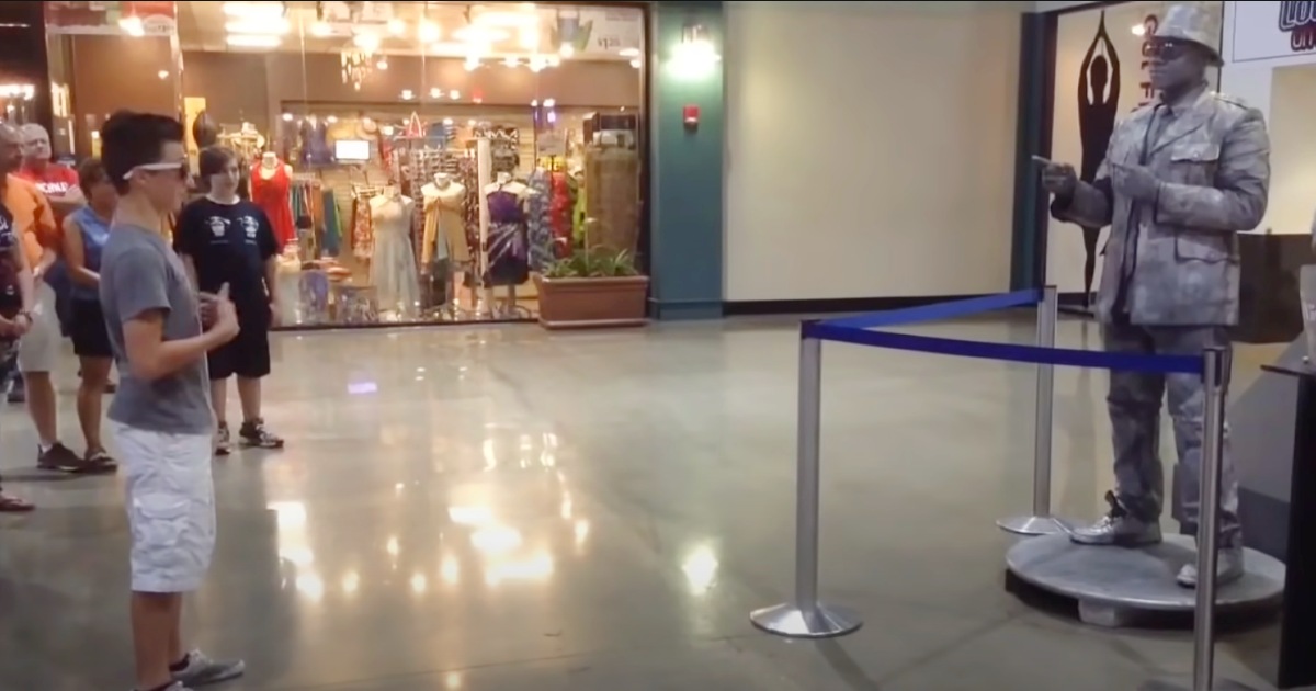 Brave boy challenges ‘statue’ to dance off crowd can’t ignore